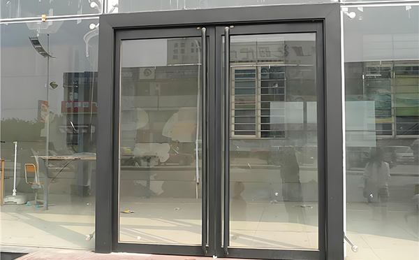 民乐玻璃地弹门